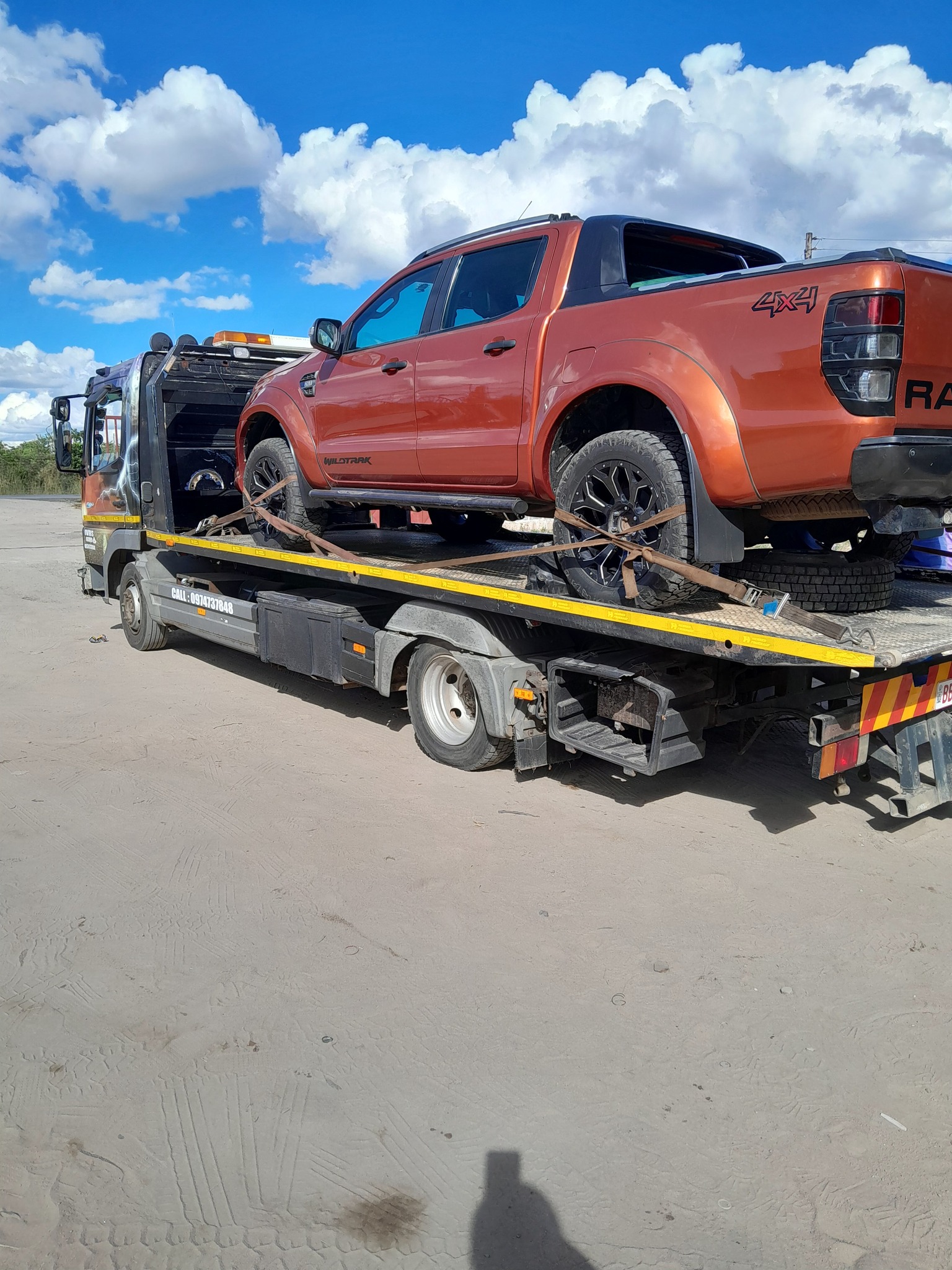 Tow truck providing roadside assistance